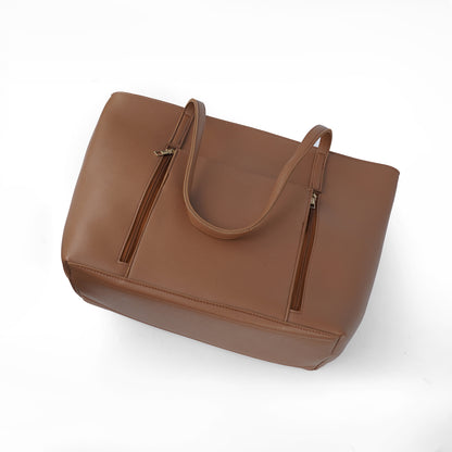 Angled top view of the Zara brown tote bag, highlighting the front pockets and shoulder straps