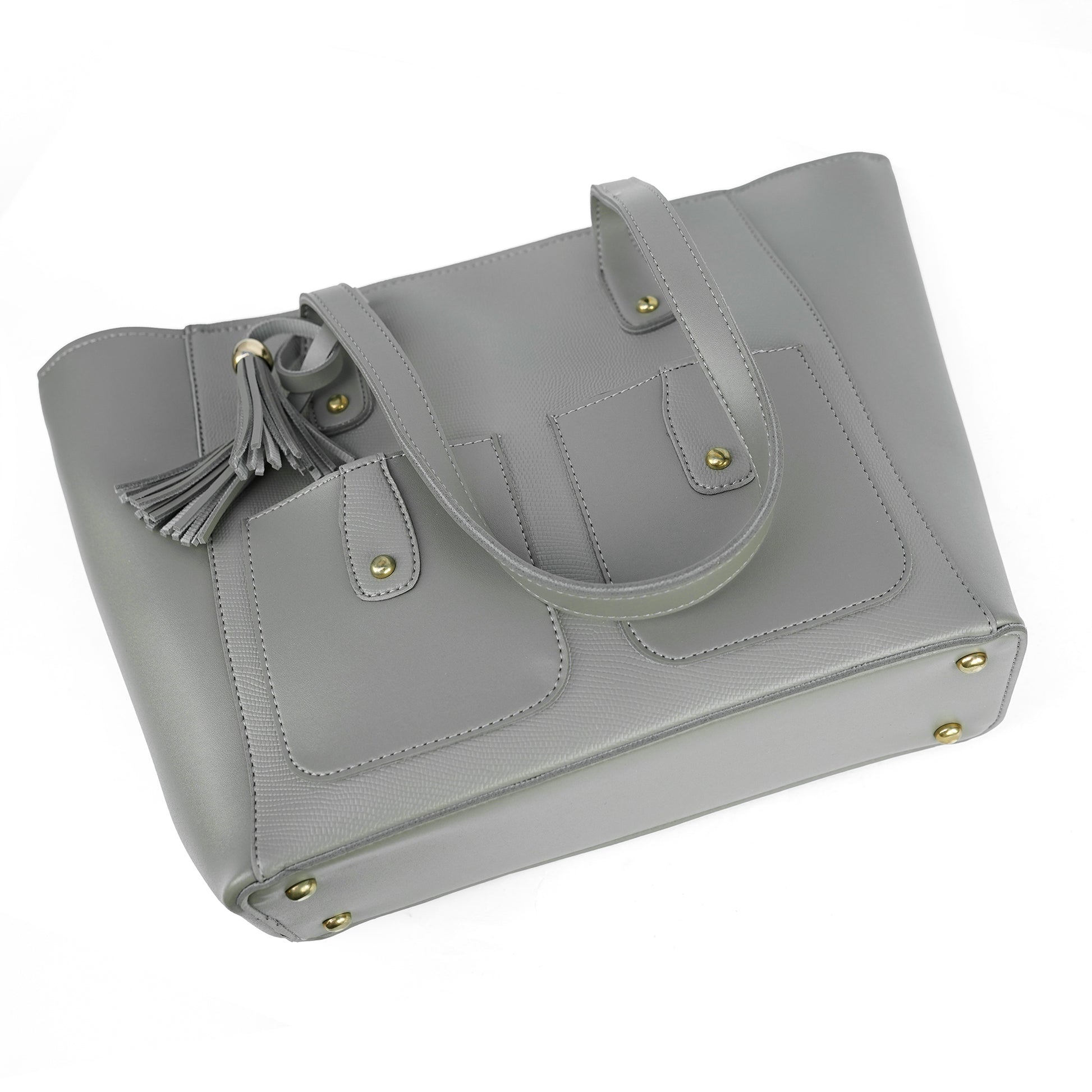 Angled view of the Alizeh grey tote bag, highlighting the chic tassel detail and structured design