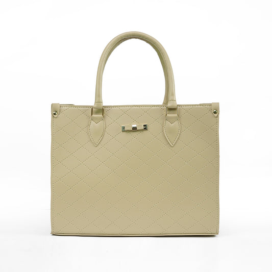 Beige quilted handbag with a silver clasp on a white background