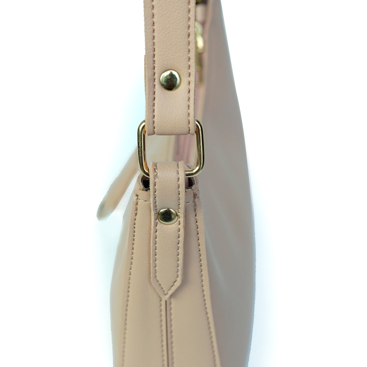 Close-up of pink shoulder bag strap and fitting