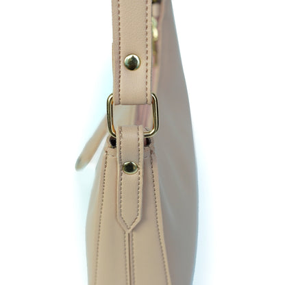 Close-up of pink shoulder bag strap and fitting