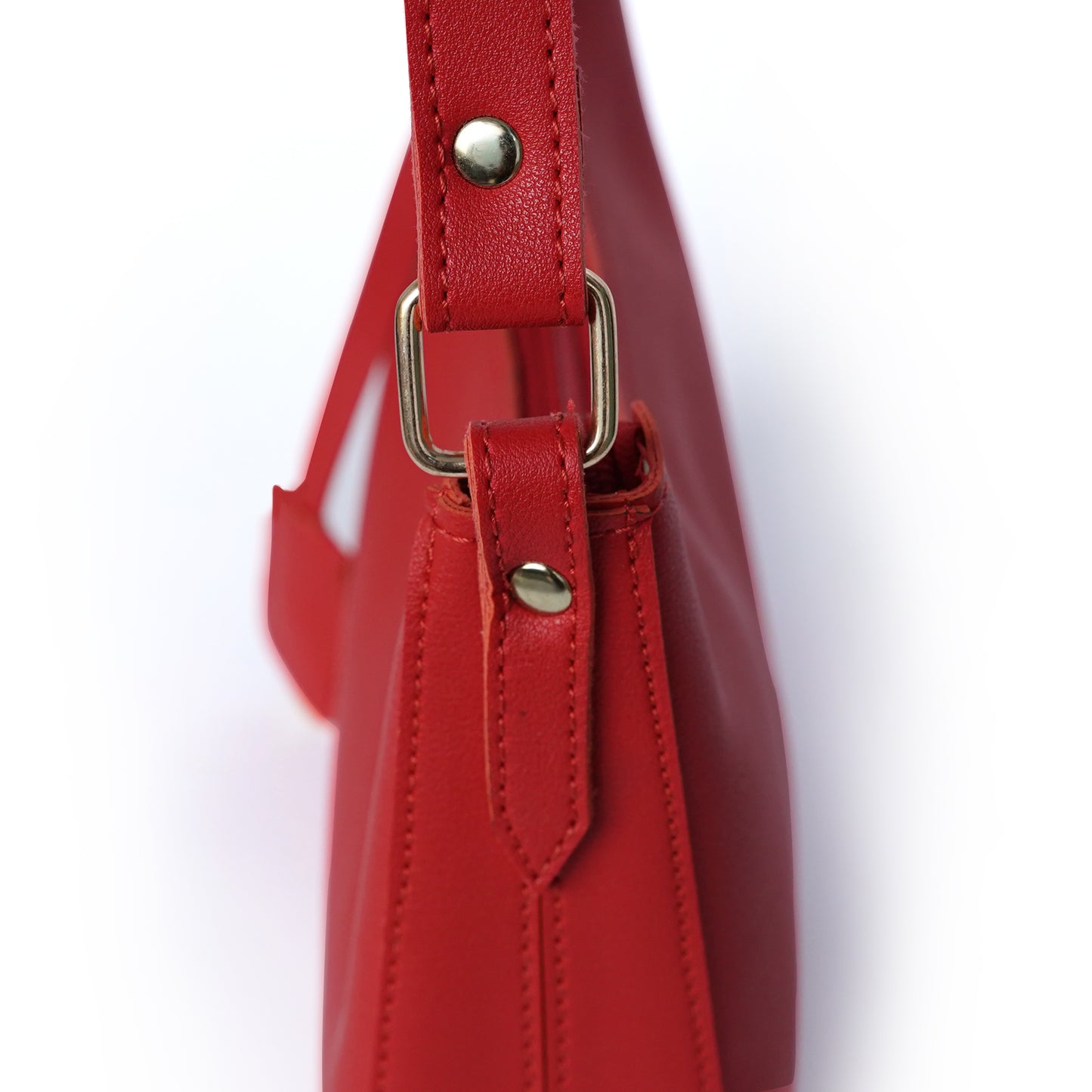 Close-up view of red shoulder bag with fitting