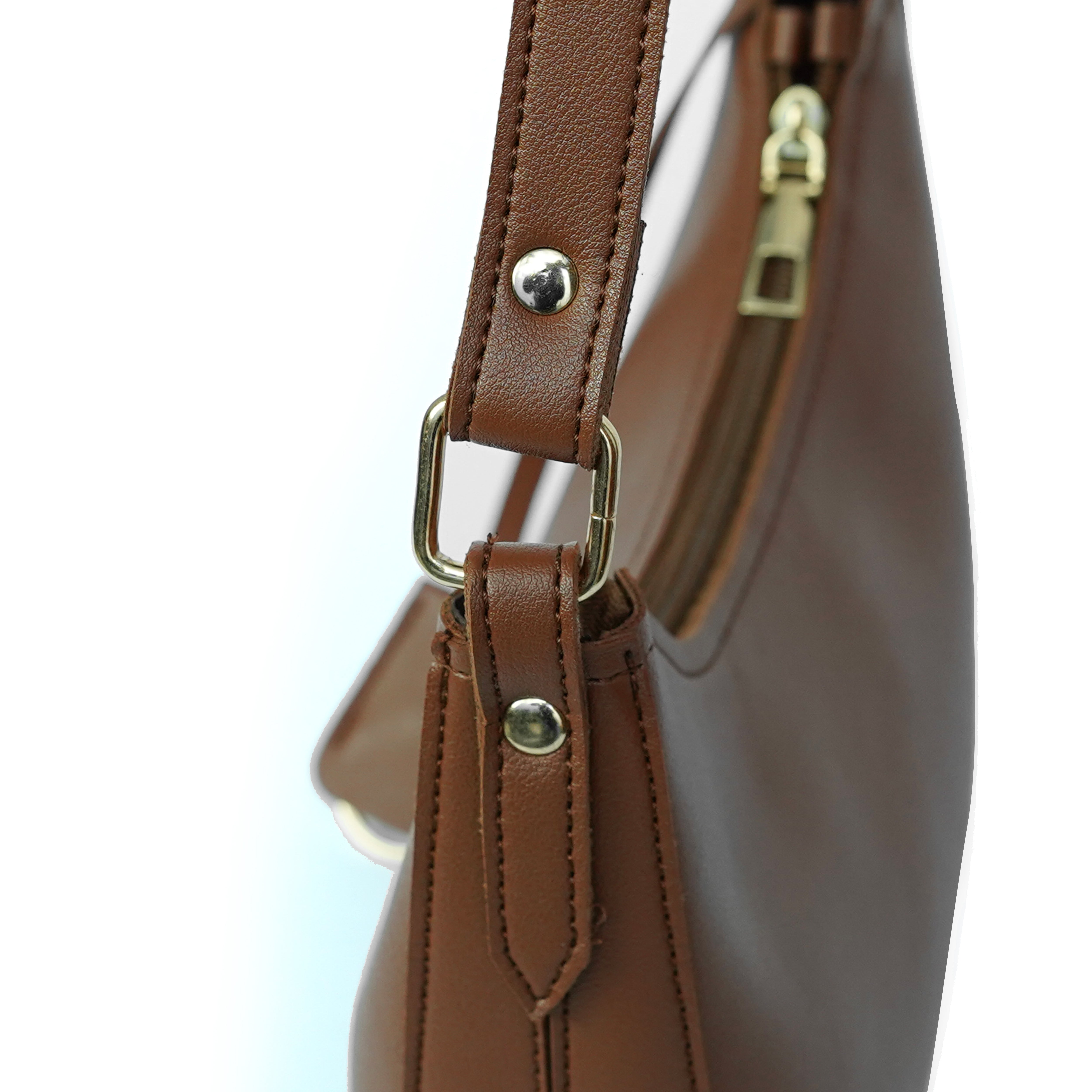 Detailed close-up of brown shoulder bag and fitting