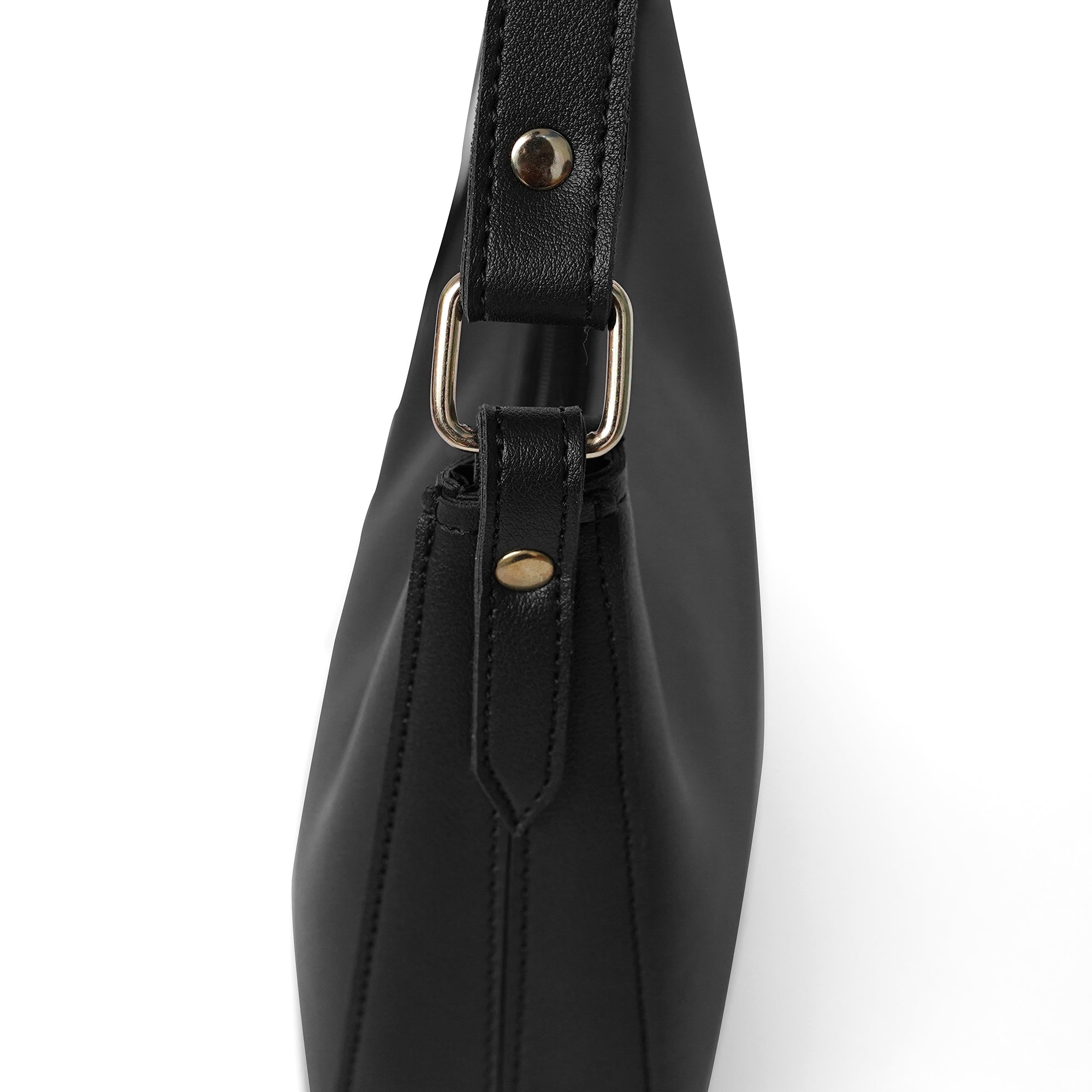 Detailed view of black shoulder bag with handle fitting