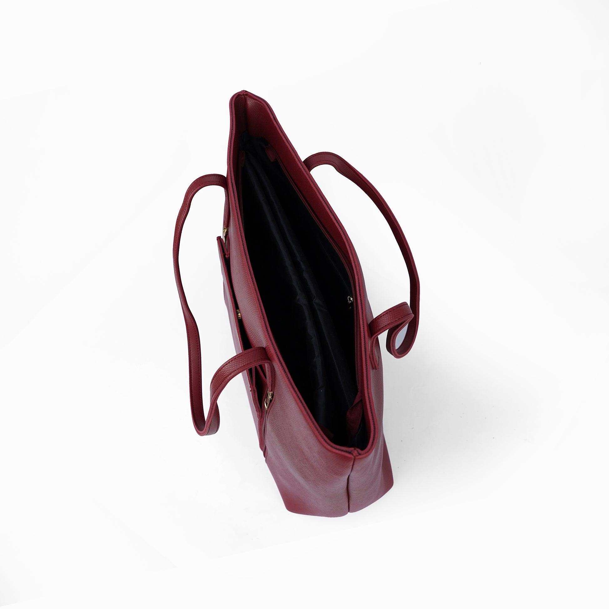 Interior view of the Zara maroon tote bag, displaying the organized interior with pockets