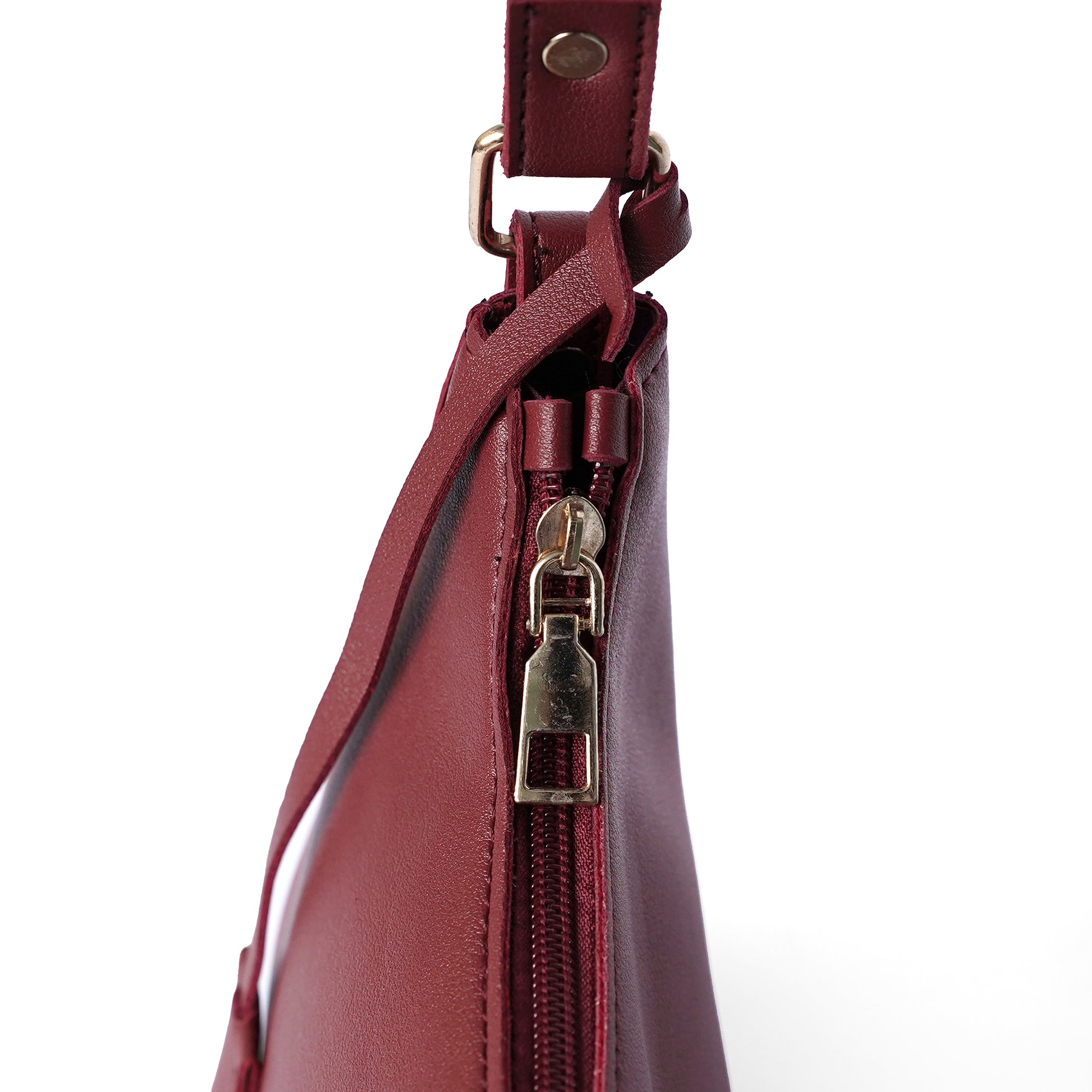 Maroon shoulder bag with handle design and zip closure
