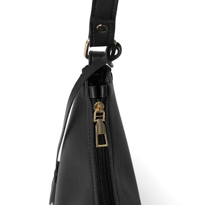 Zip closure on black faux leather shoulder bag