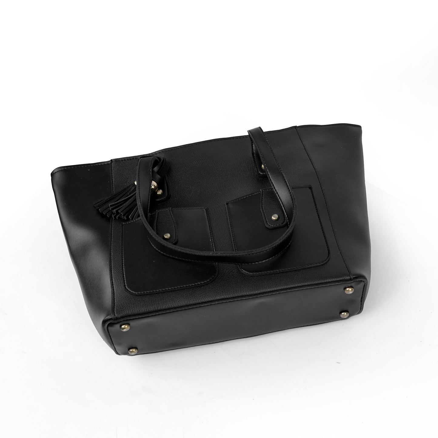Angled view of the Alizeh black tote bag, highlighting the front flap pockets and dual shoulder straps.