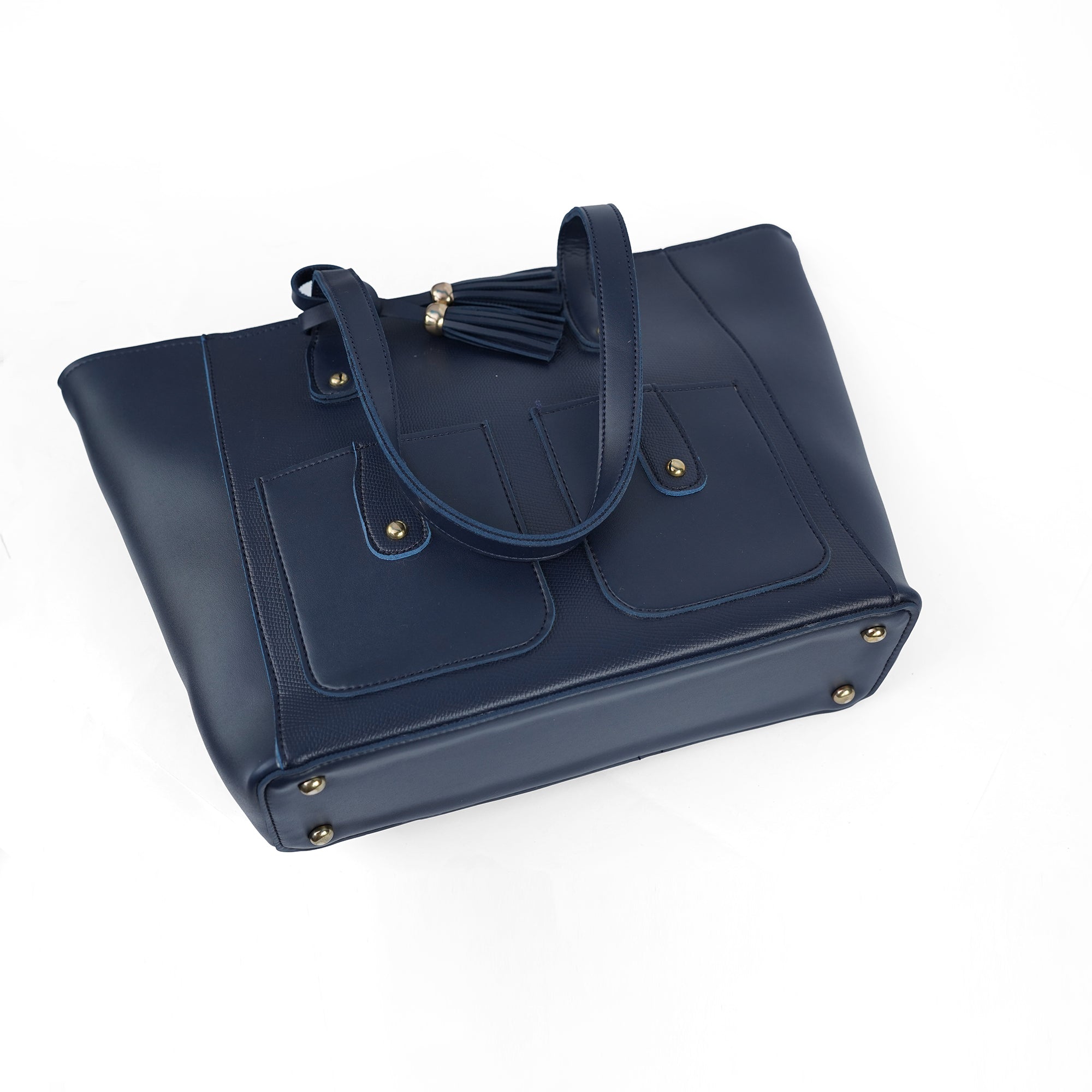 Angled view of the Alizeh blue tote bag, highlighting the stylish tassel and structured form