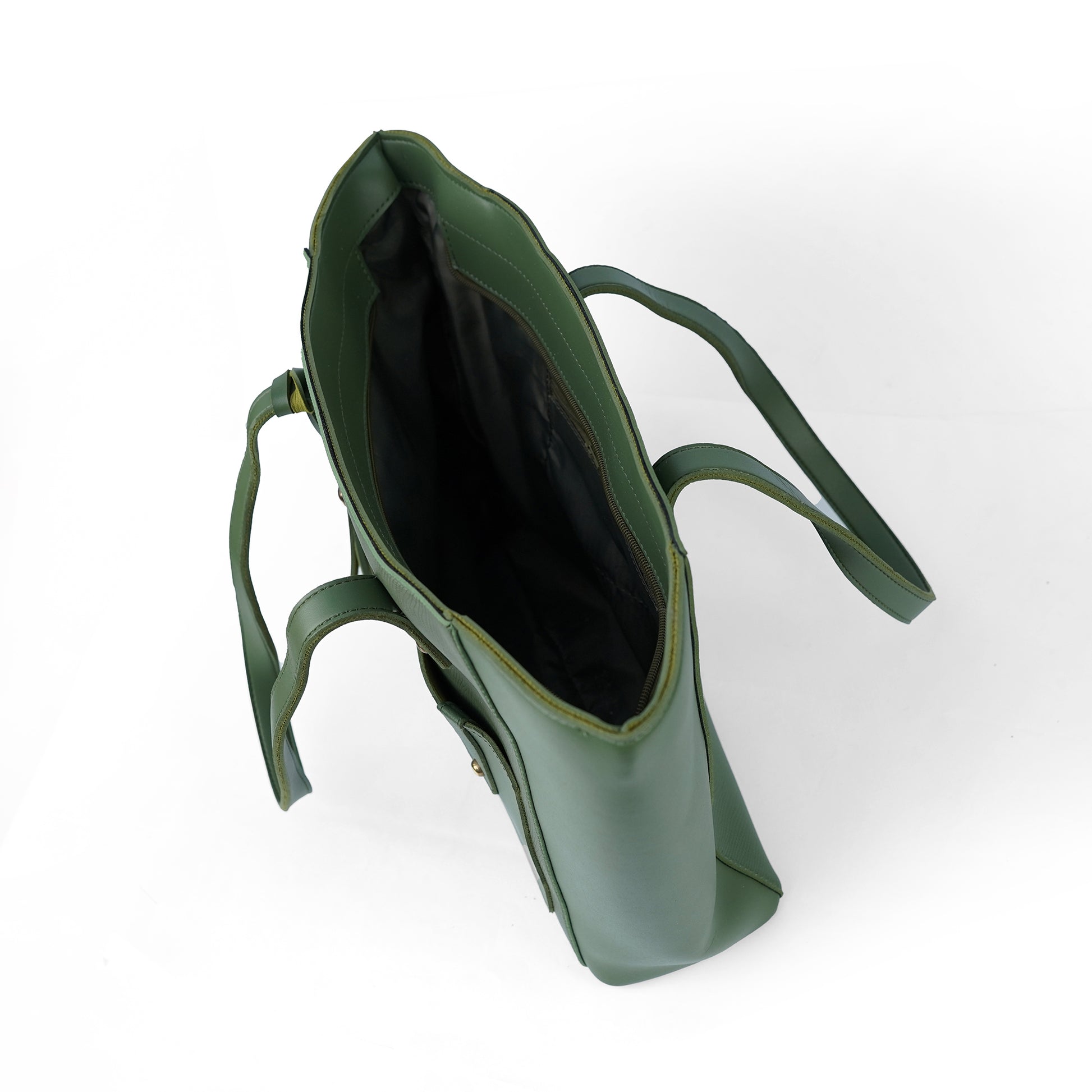Interior view of the Alizeh green handbag, showcasing its spacious and organized interior