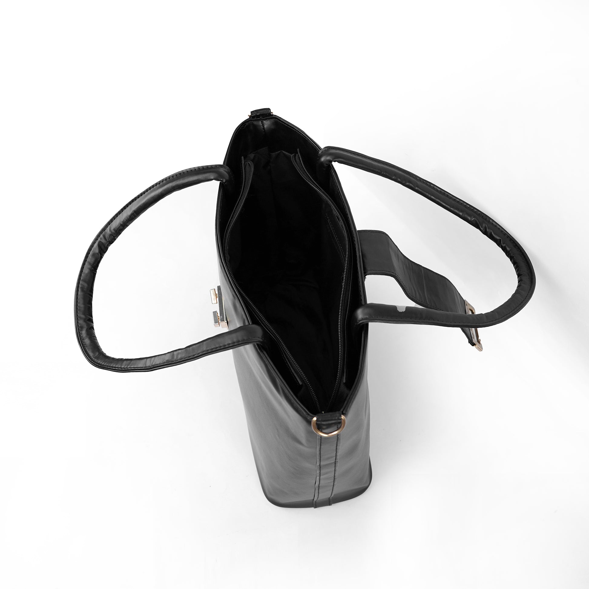 Interior view of the Serena black tote bag showing the spacious main compartment and zip pocket