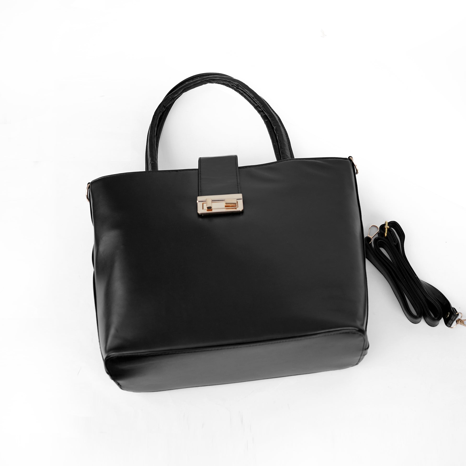Side angle of the Serena black tote showing the structured shape and top handle