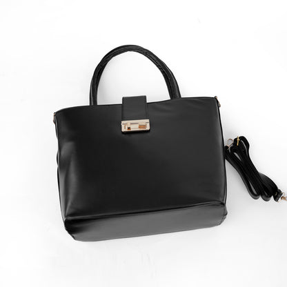 Side angle of the Serena black tote showing the structured shape and top handle